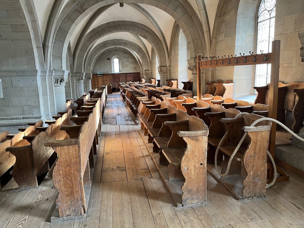 a room with wooden benches and a wooden floor