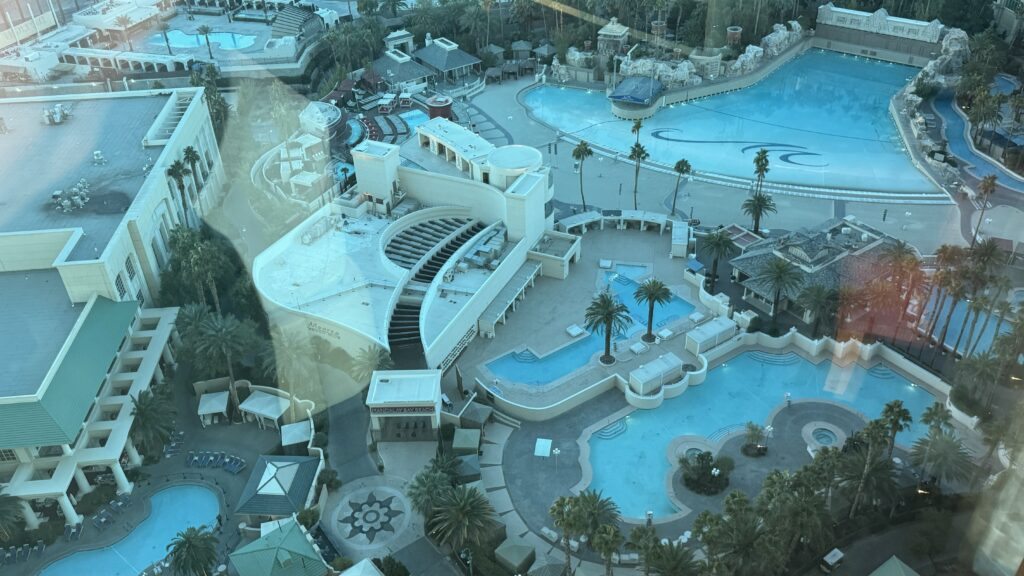 a pool and buildings with trees and buildings