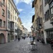 a street with buildings and a table