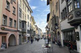 a street with buildings and a table