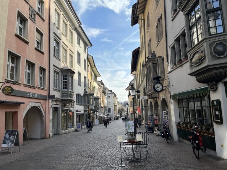 a street with buildings and a table