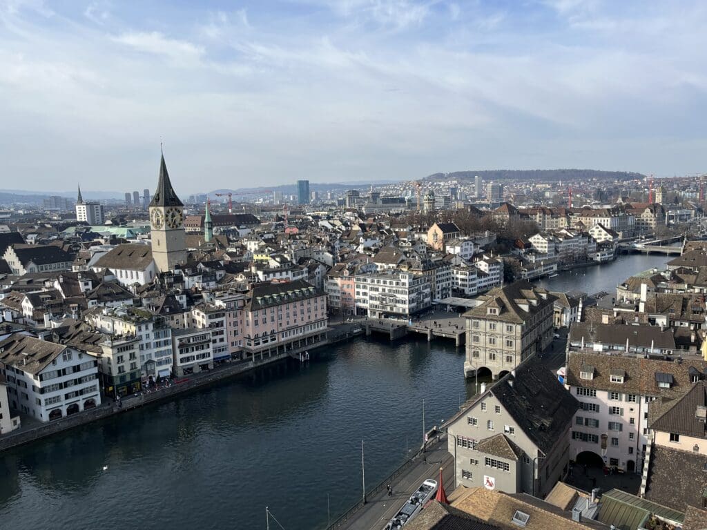 a city with buildings and a river