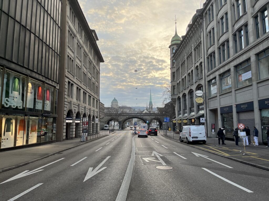 a street with cars and buildings