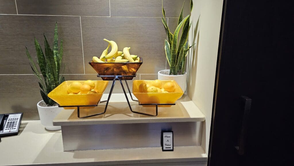 fruit in a bowl on a shelf