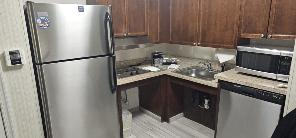 a kitchen with a sink and a refrigerator