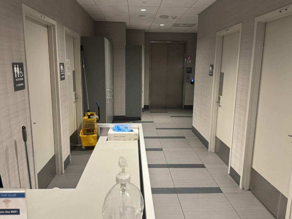 a hallway with a bottle of liquid on a counter