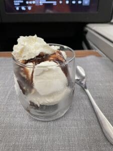 a glass cup with ice cream and chocolate sauce