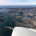 an aerial view of a city and water