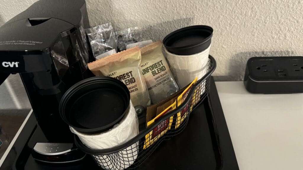 a basket with coffee and condiments