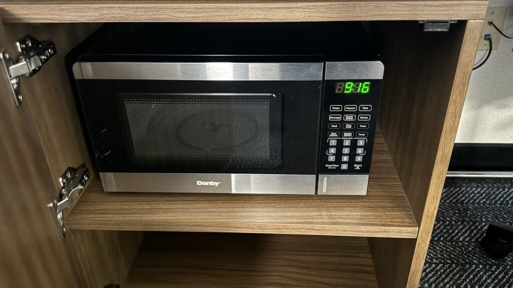 a microwave on a shelf