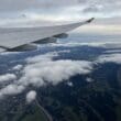 an airplane wing above clouds