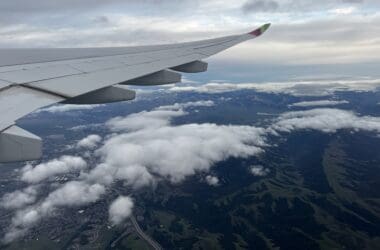 an airplane wing above clouds