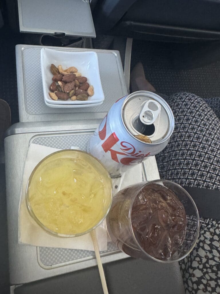 a drink and a can on a tray