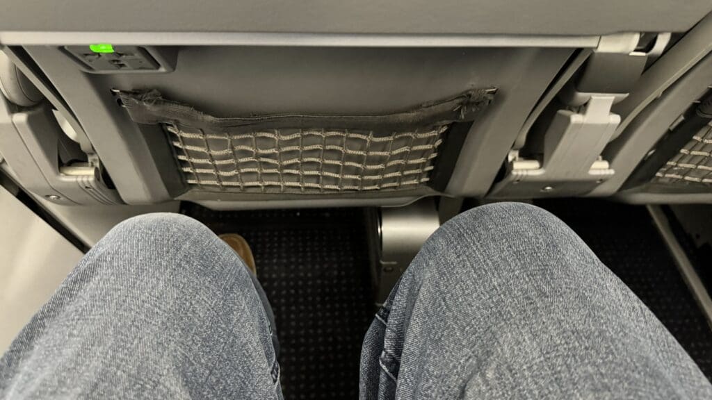 a person's legs in a seat