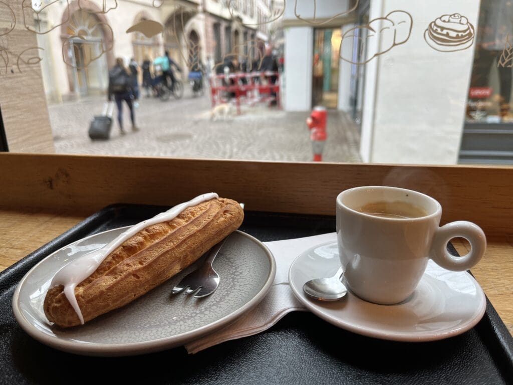 a plate of food and a cup of coffee