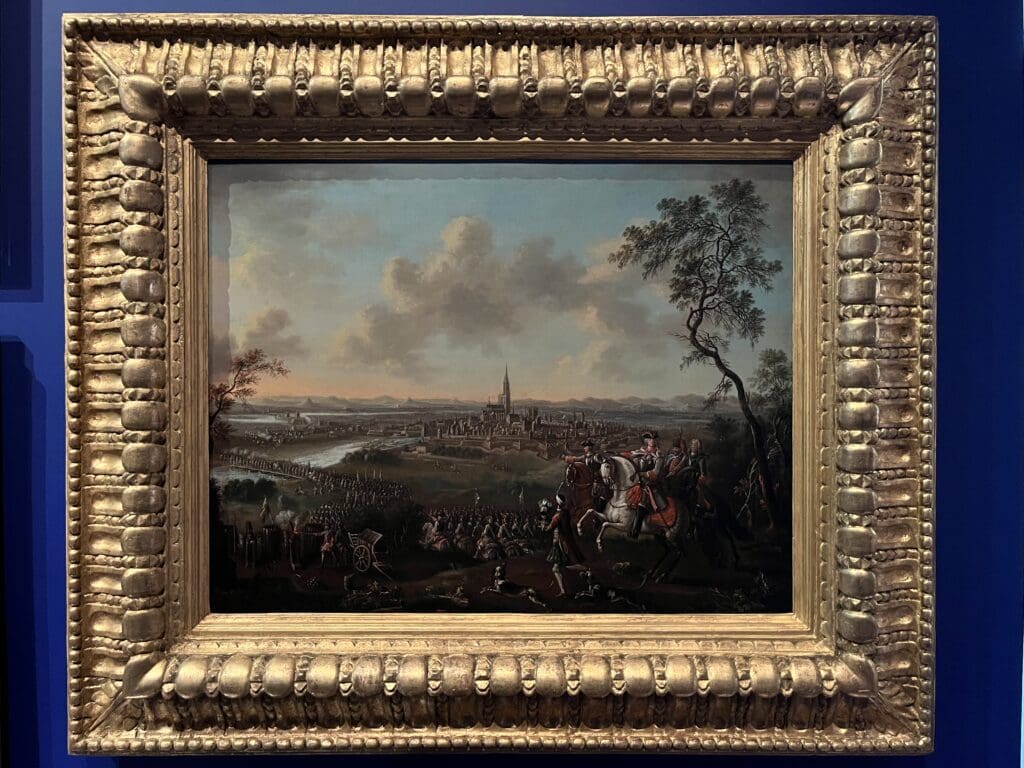 a framed painting of a landscape