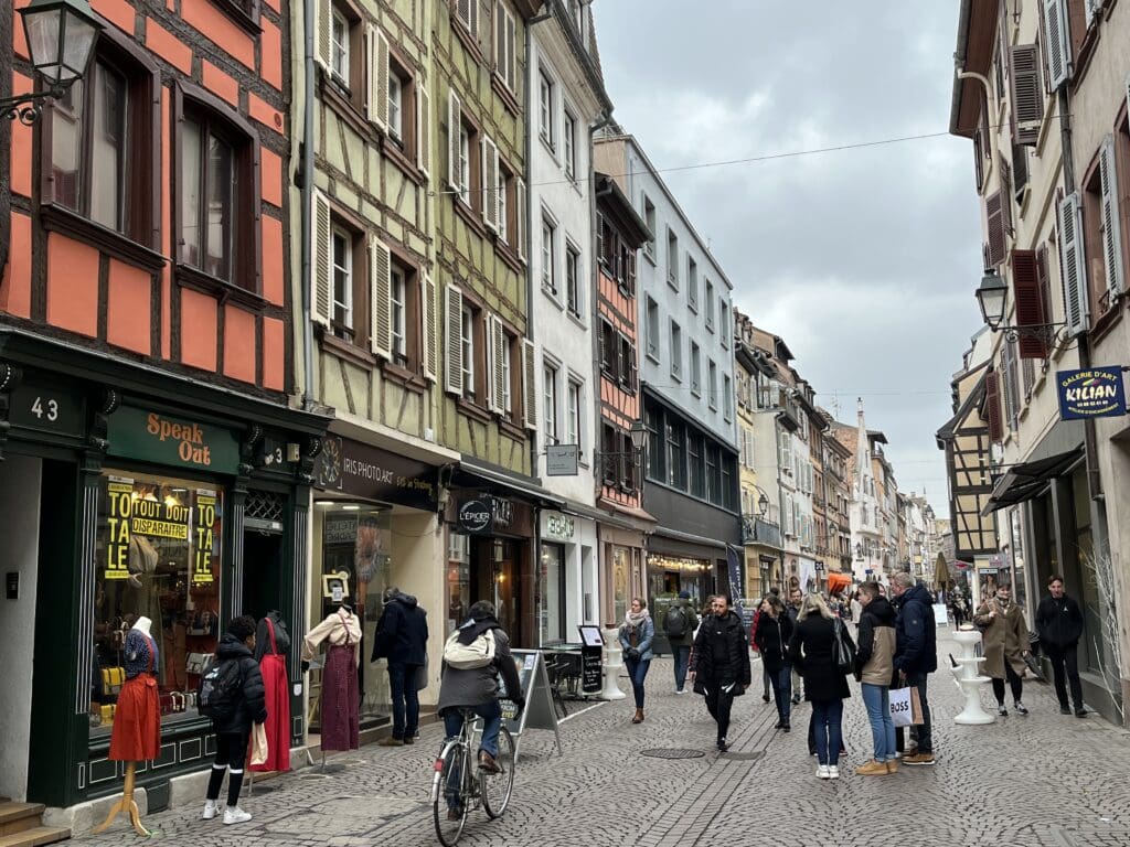 a group of people walking on a street