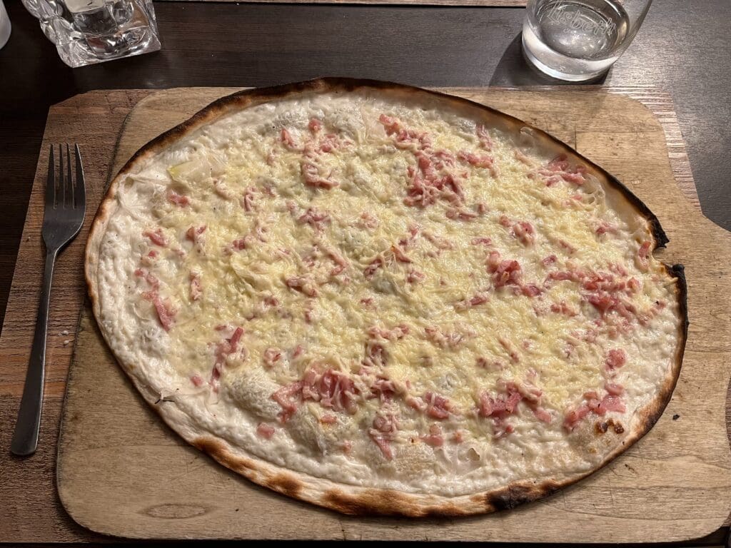 a pizza on a wooden board