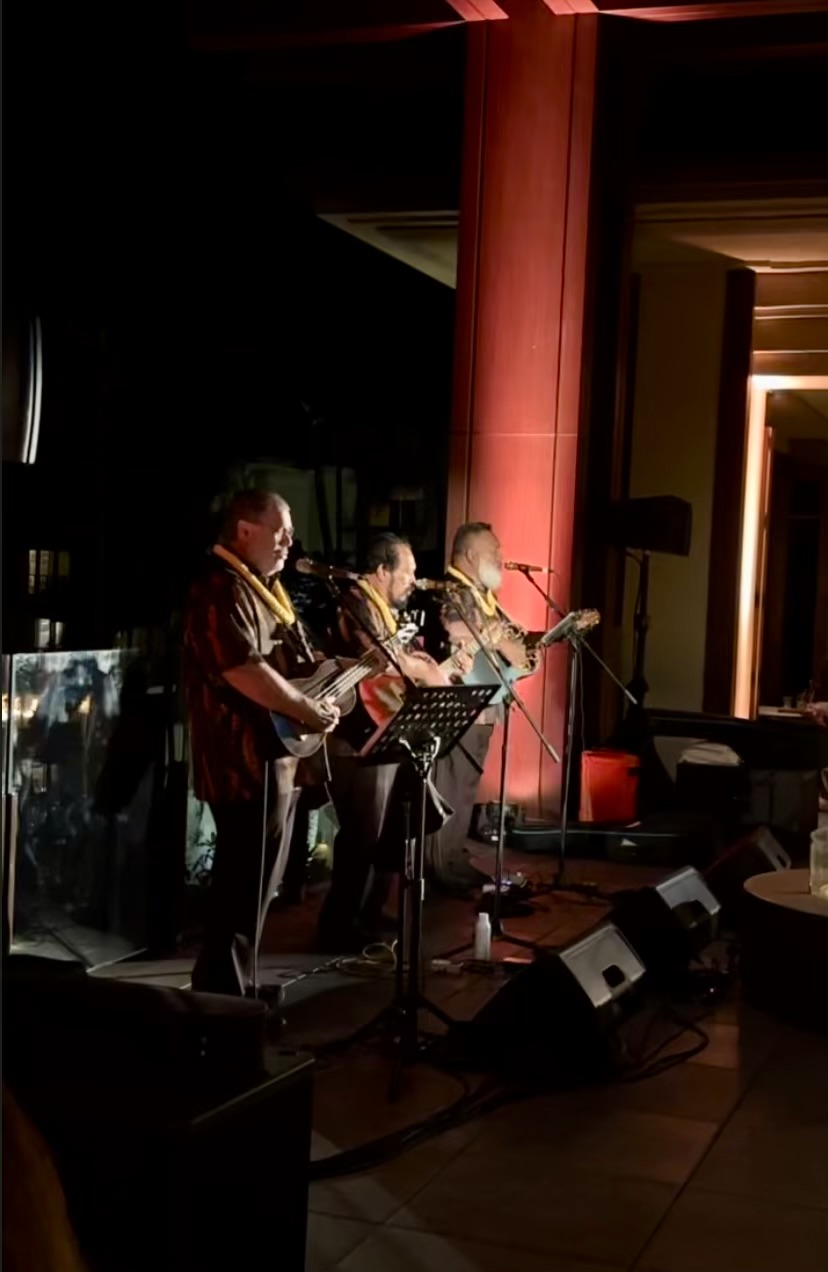 a group of men playing instruments on stage