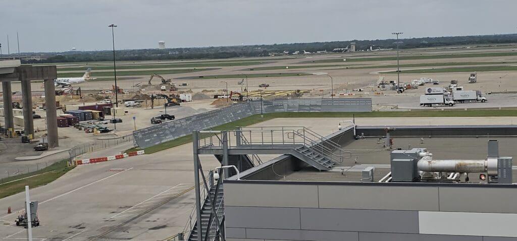 a building with a ramp and a field