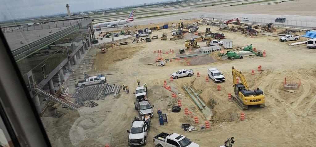 a construction site with vehicles and construction equipment
