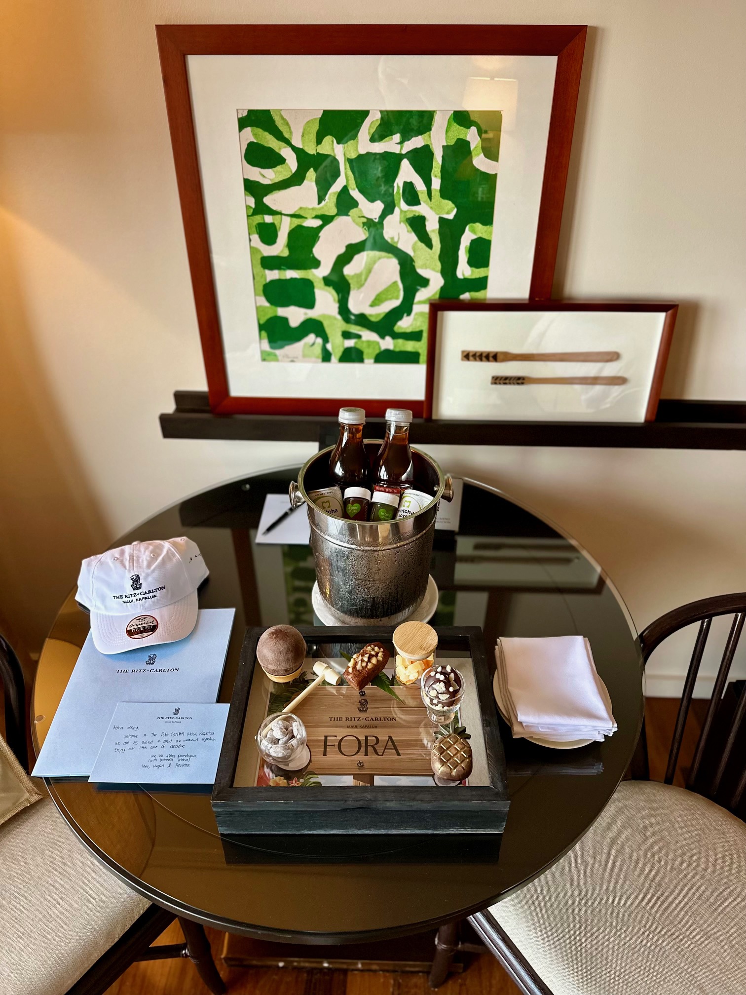 a table with a bucket of beer and a tray of food