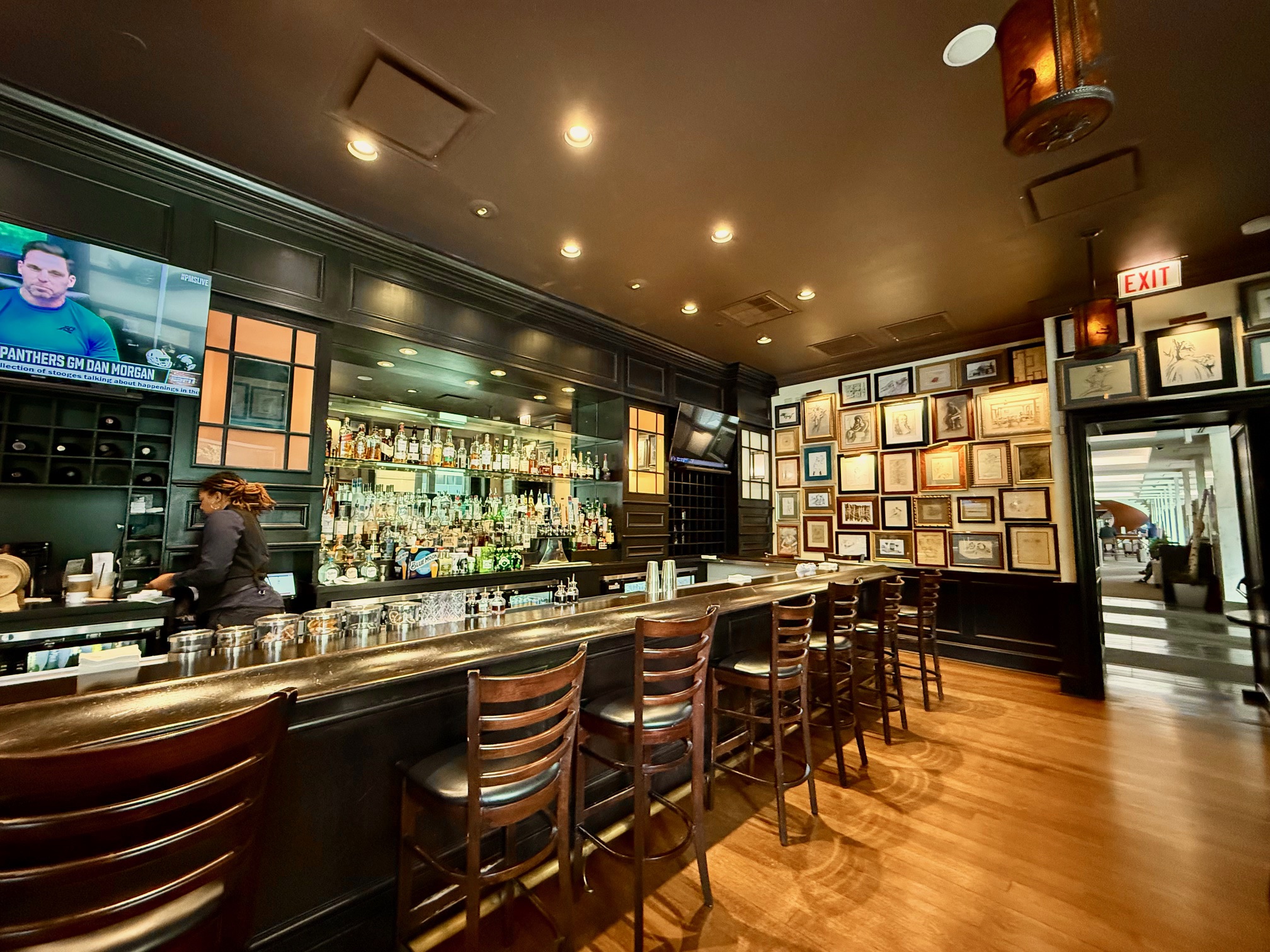a bar with a woman behind the counter at the Westin Michigan Avenue