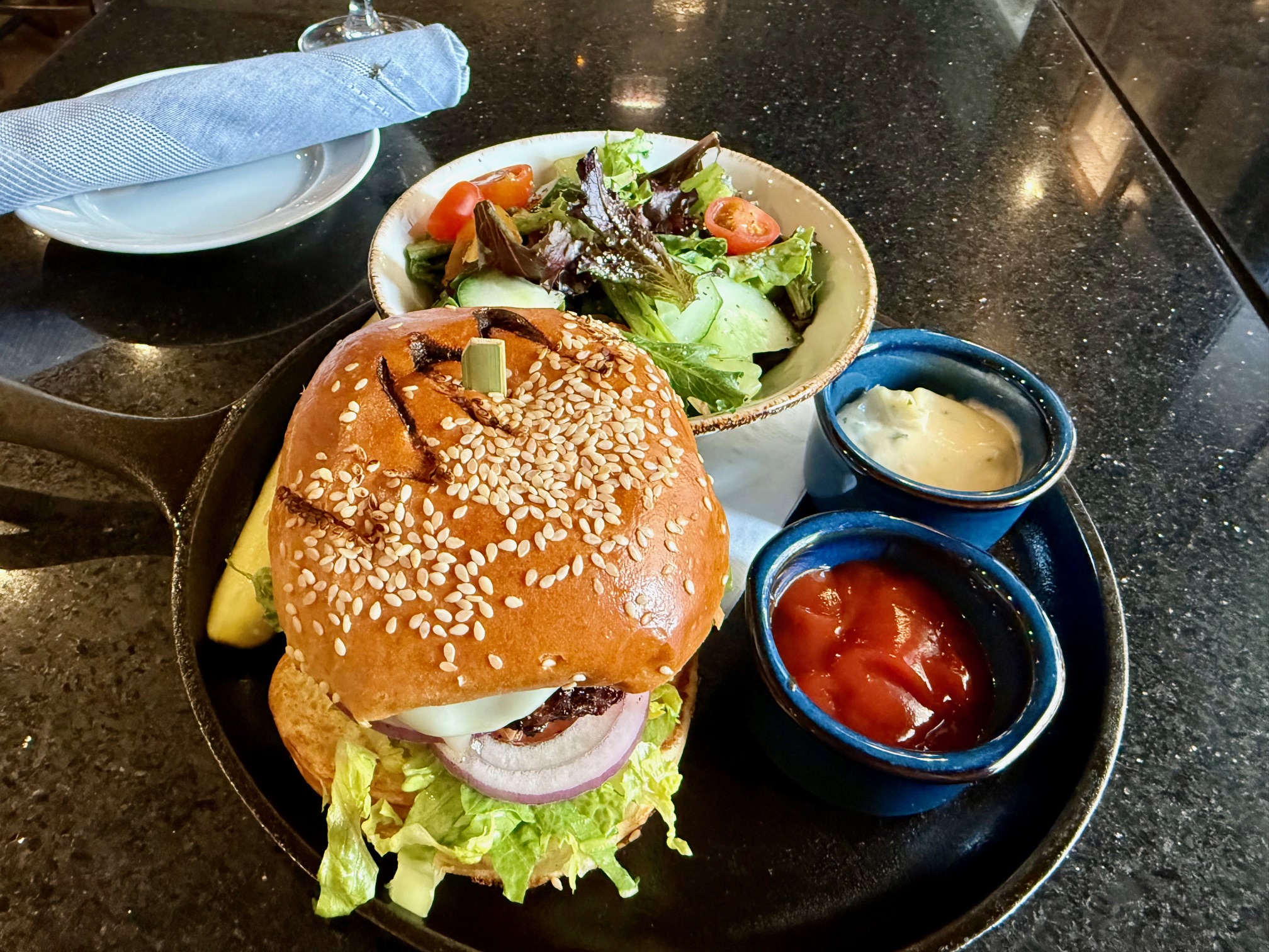 a burger and salad on a plate at the Westin Michigan Avenue