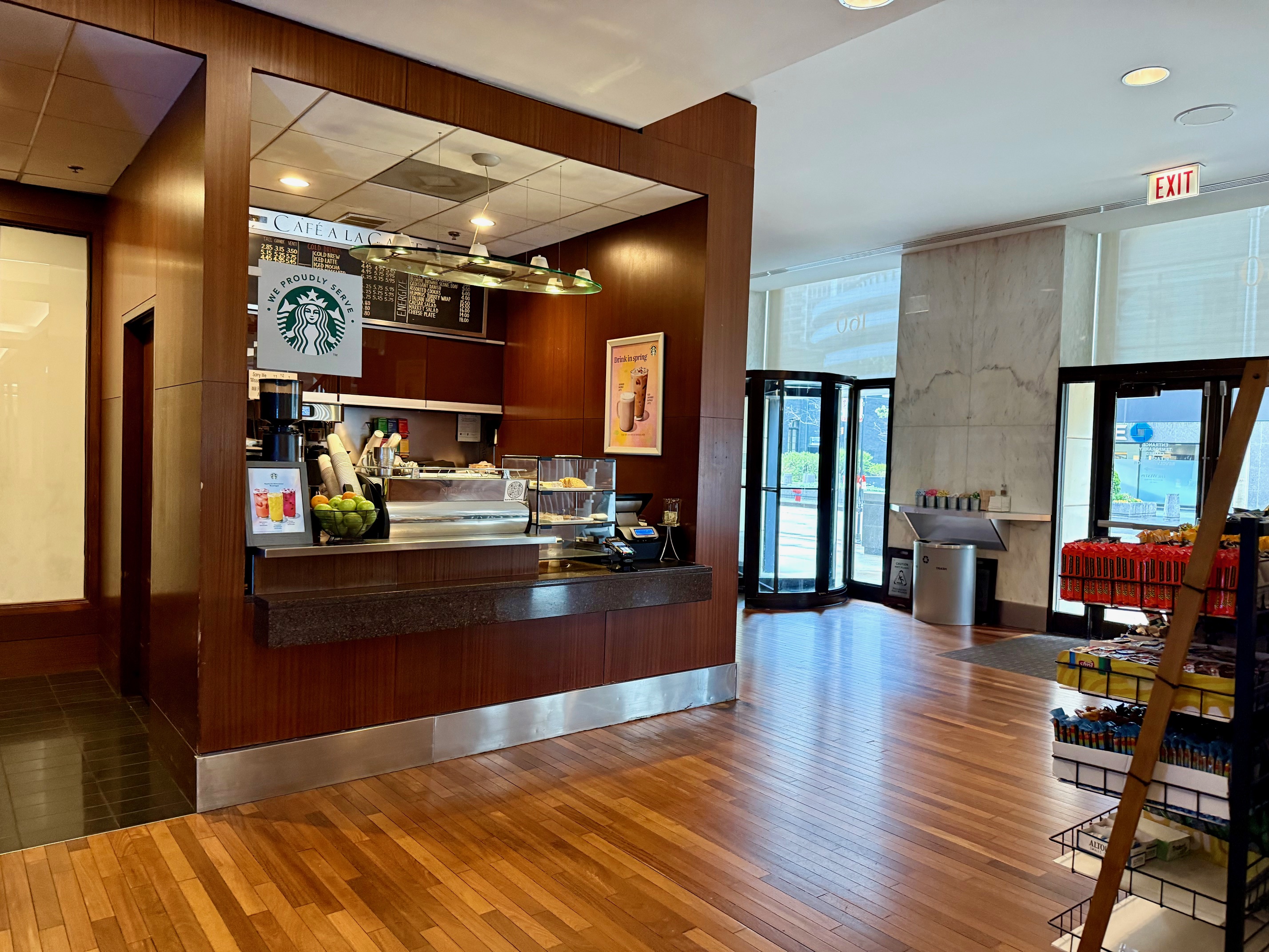 a coffee shop with a counter and a wood floor