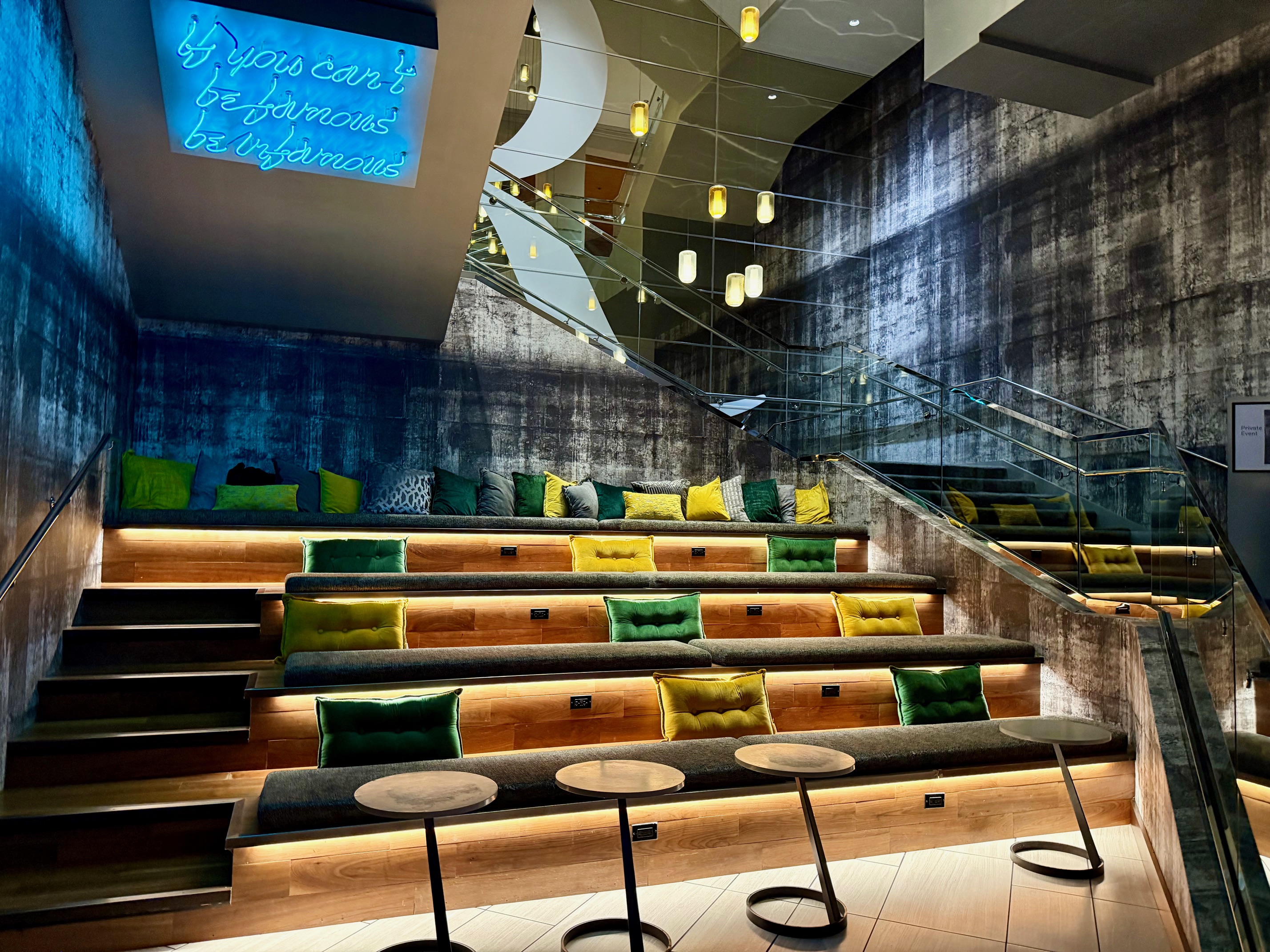 a seating area with a blue screen
