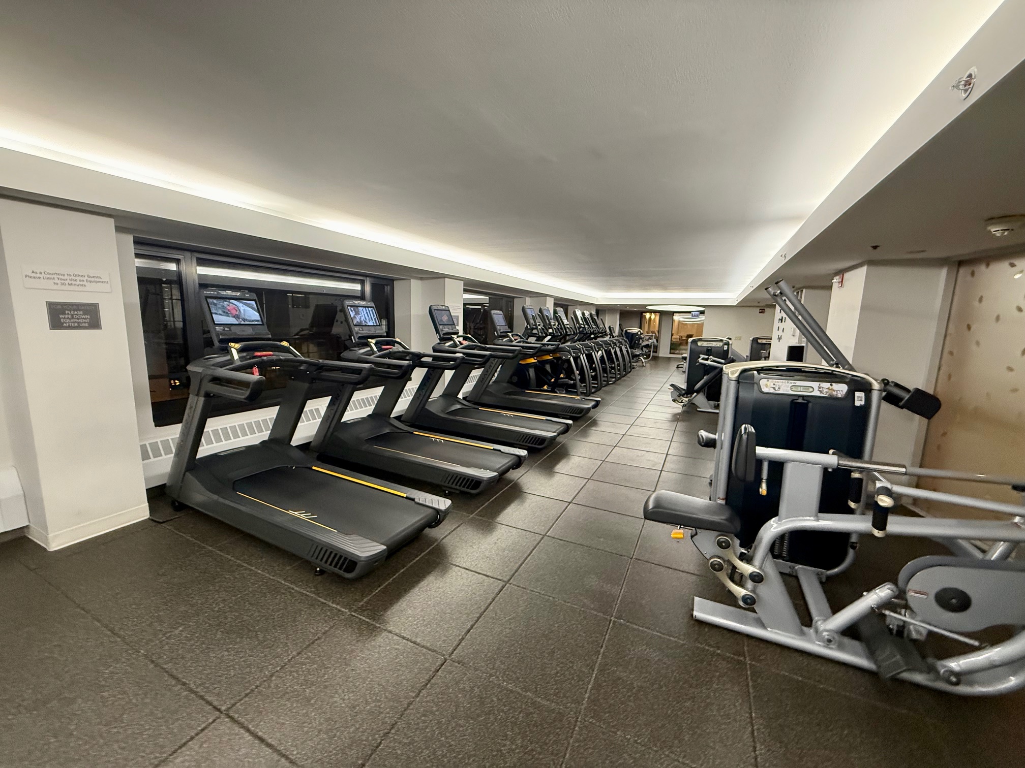 a group of treadmills in a gym