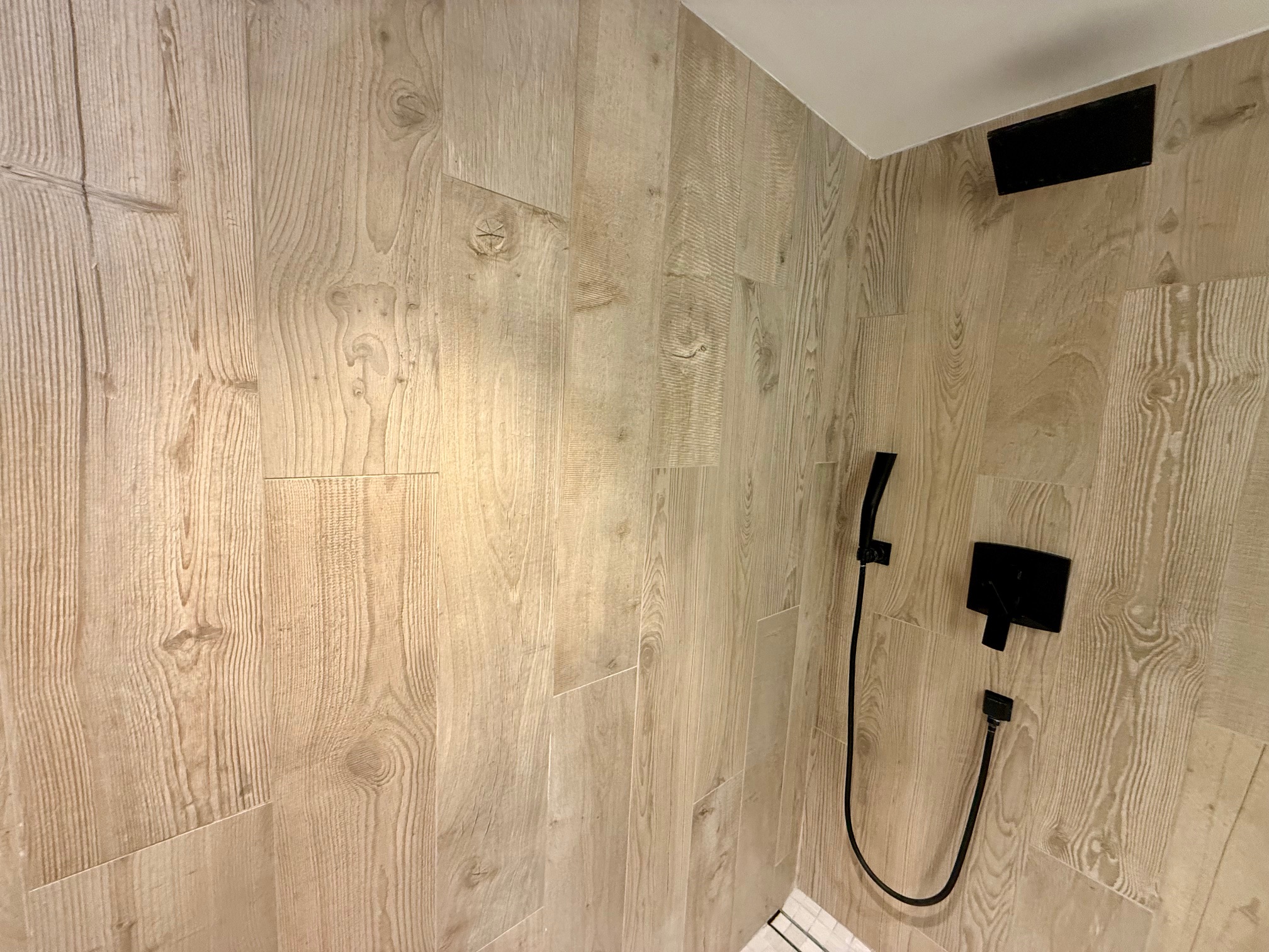 a shower with a hose attached to it at the Montauk Yacht Club