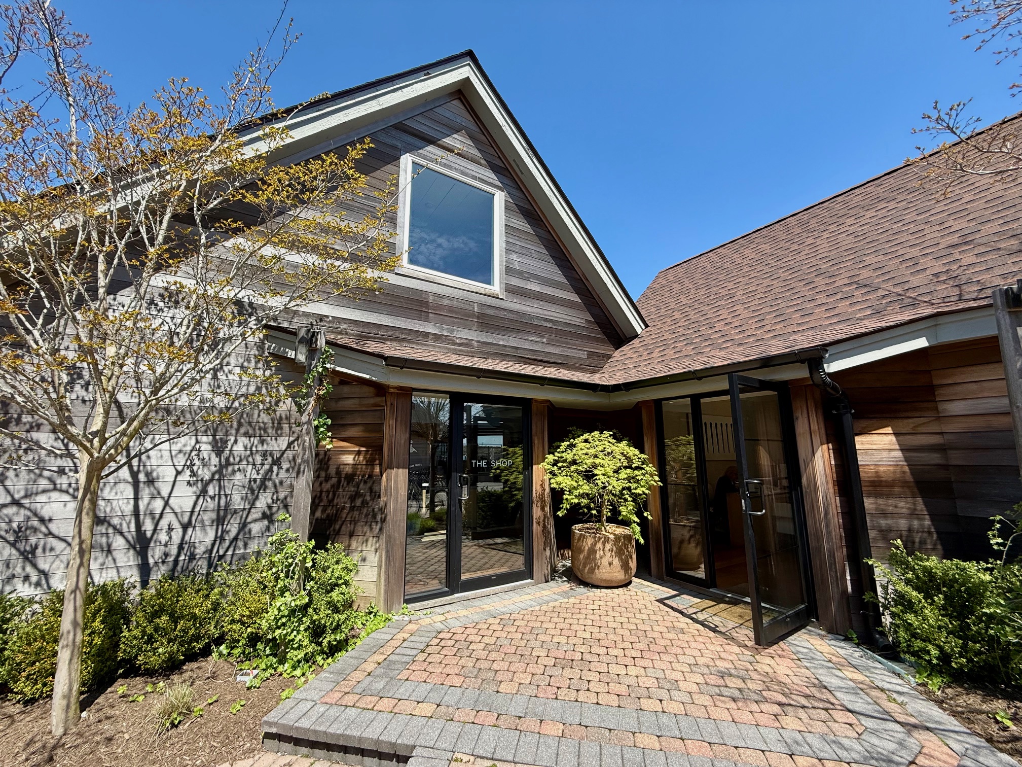 a house with a brick walkway and a glass door