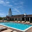 a pool with lounge chairs and umbrellas at the Montauk Yacht Club