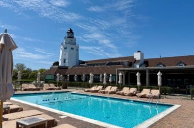 a pool with lounge chairs and umbrellas at the Montauk Yacht Club