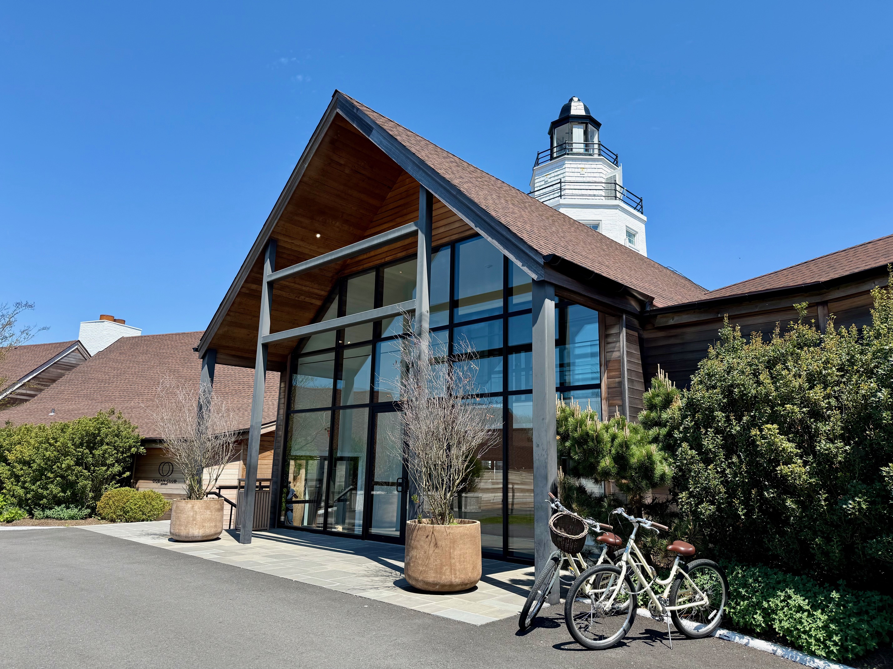 a building with a glass front door and a few bicycles at the Montauk Yacht Club