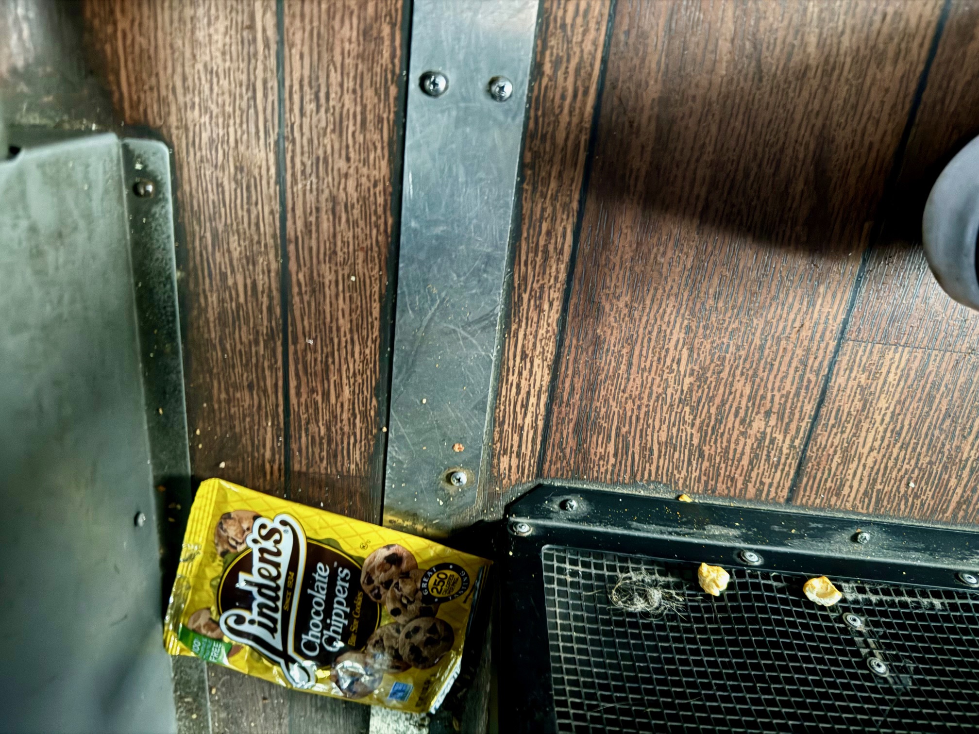 a chocolate chip cookie on a wood surface