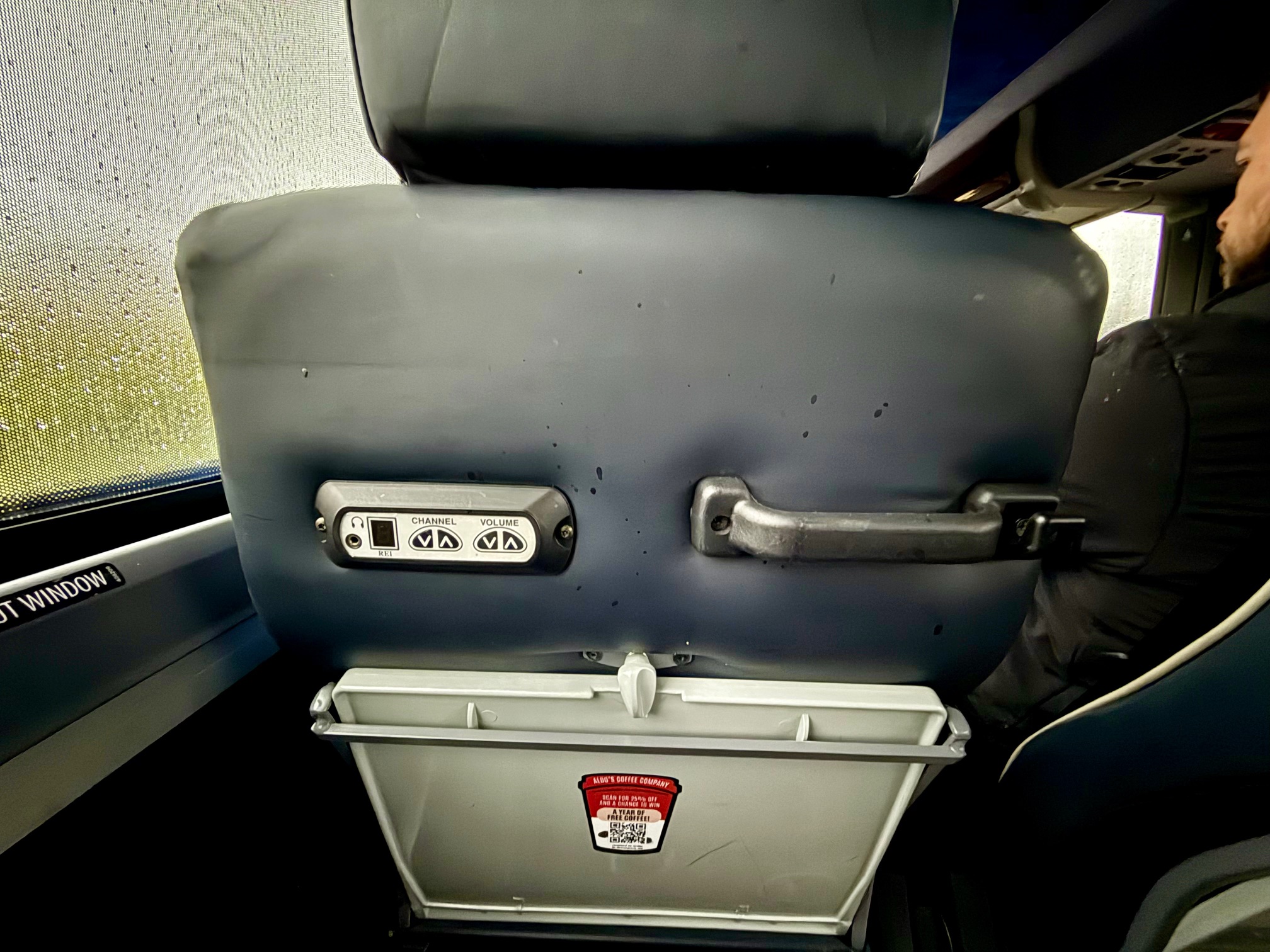 a seat with a grey seat and a grey seat with a red label