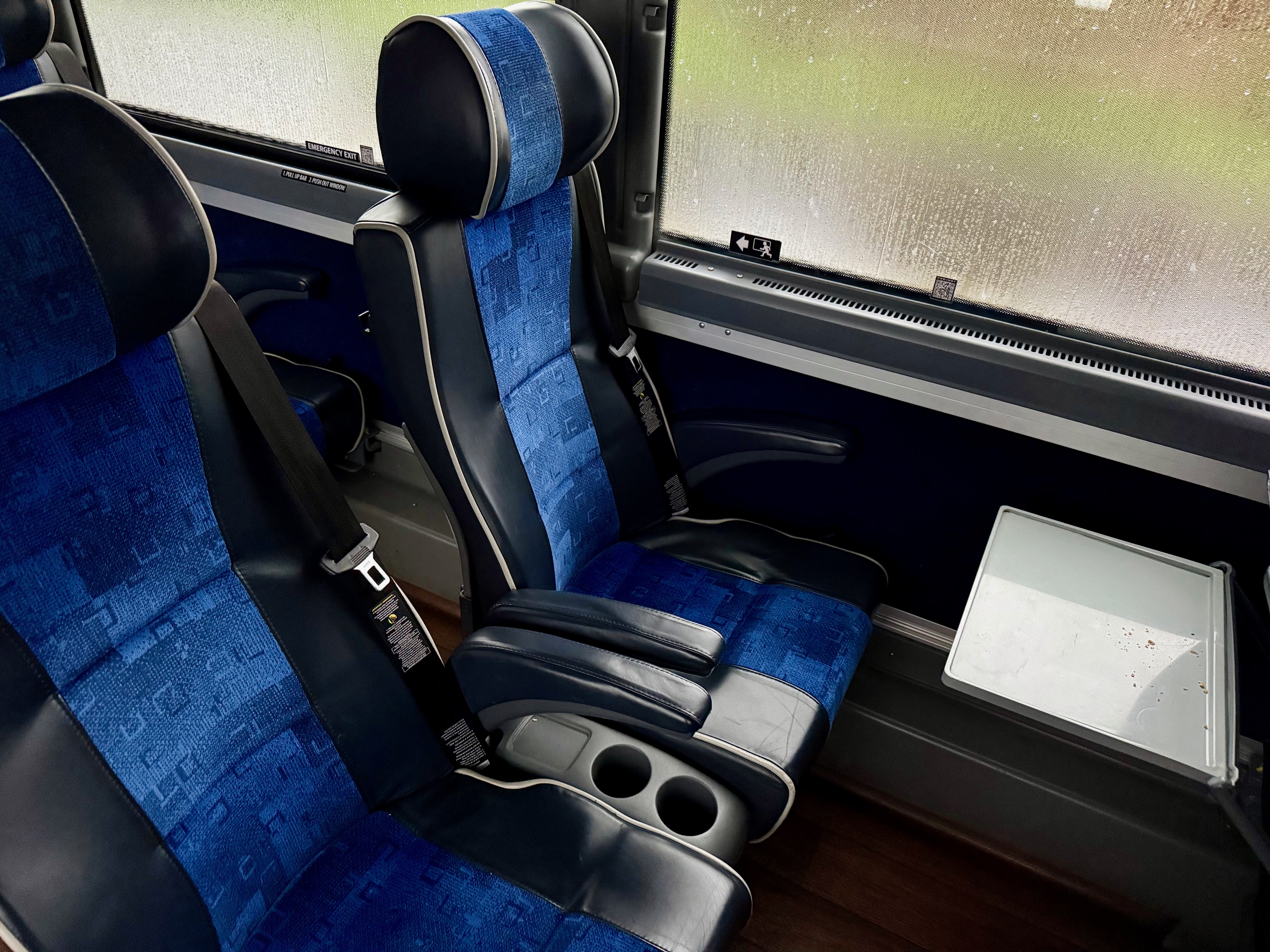 a blue and black seats in a bus