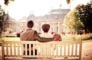 a man and woman sitting on a bench