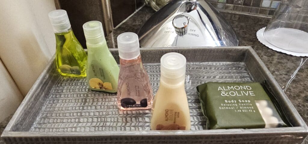 a group of small bottles of shampoo on a tray