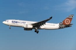 a white airplane flying in the sky