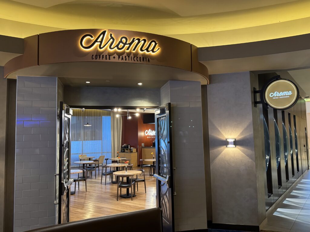 a room with a clock and tables