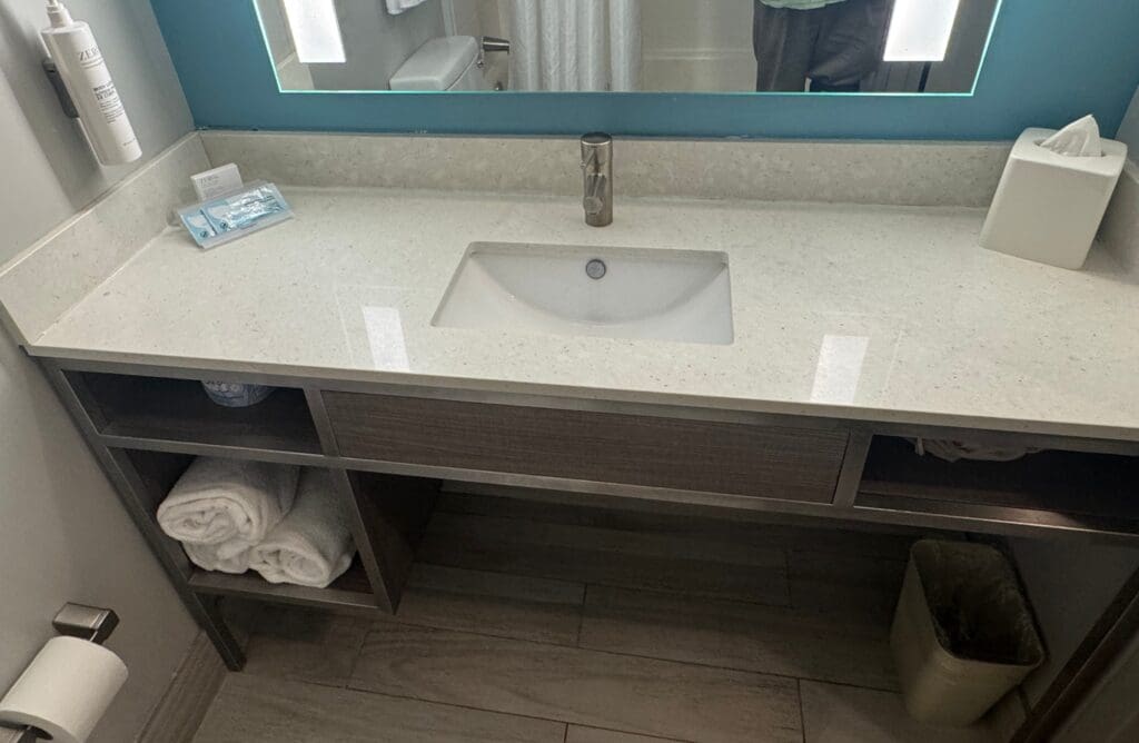 a bathroom sink with a mirror