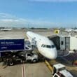 a JetBlue A321 Classic plane parked at an airport