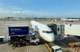 a JetBlue A321 Classic plane parked at an airport