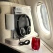 a drink and headphones on a table