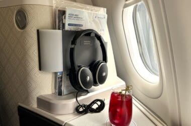 a drink and headphones on a table