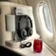 a drink and headphones on a table