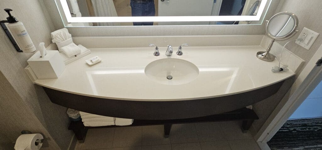 a bathroom sink with a mirror